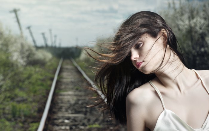 The rail way behind the girl