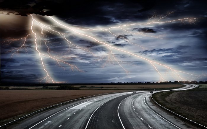 Thunderstorm over a two-way motorway