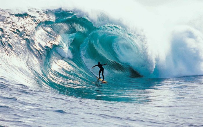 A huge wave of surfer