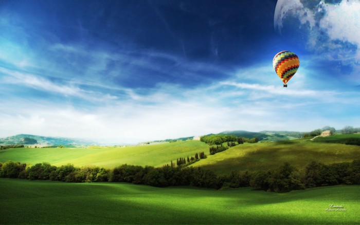 Flight in a hot air balloon over a wide field