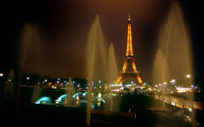 Evening fountains of Paris in the background of the tower