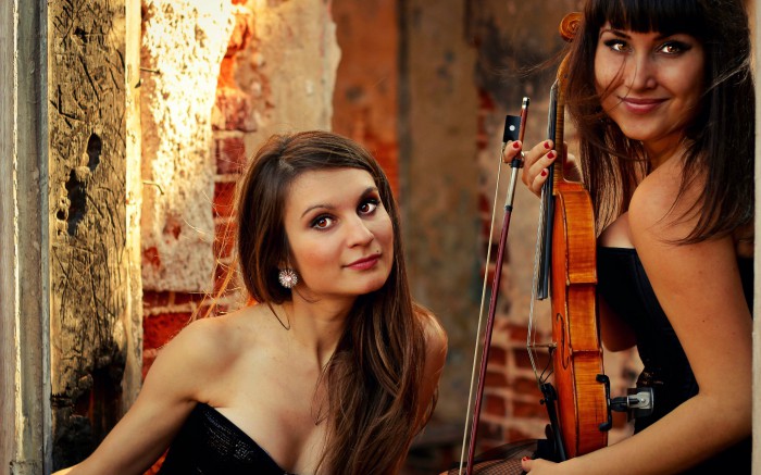 Two beautiful girls with a cello